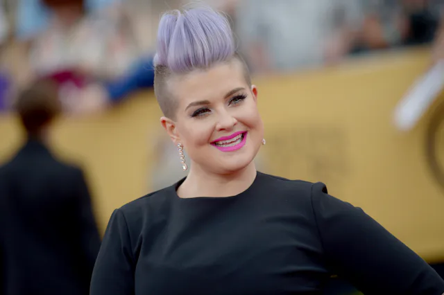 Kelly Osbourne is pregnant with her first baby. Here she is at the Screen Actors Guild Awards in 201...
