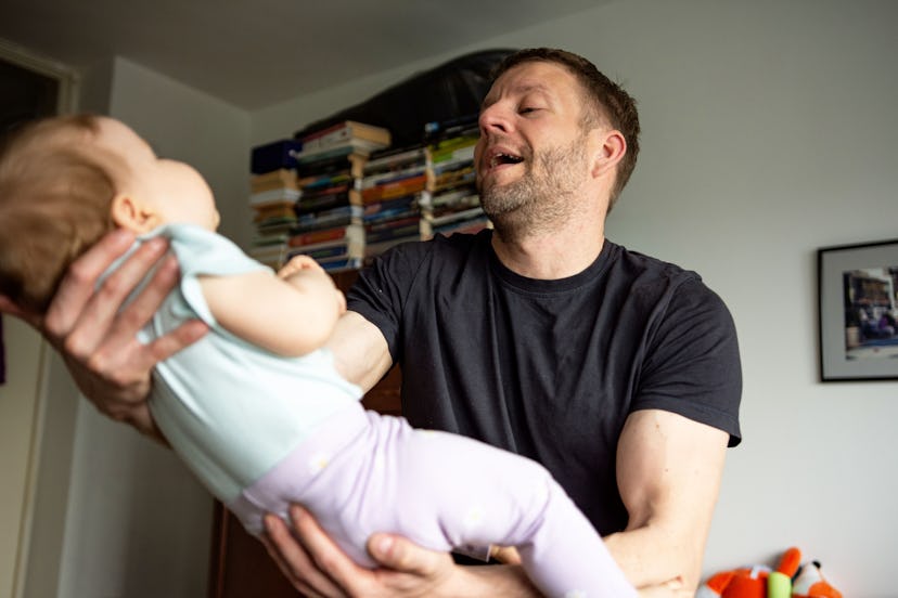 Father playing with baby daughter in living room/instagram captions for when baby says "Dada"