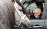 WINDSOR, ENGLAND - MAY 13: Queen Elizabeth II watches the horses from her Range Rover at The Royal W...