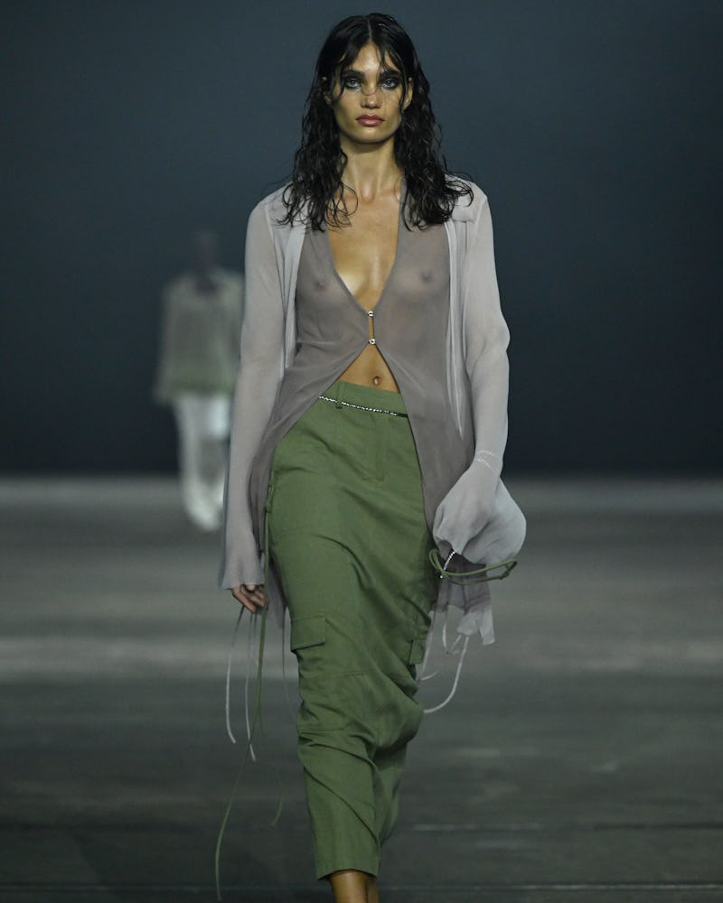 A model walks the runway during the BEC + BRIDGE show in a green midi skirt during Afterpay Australi...