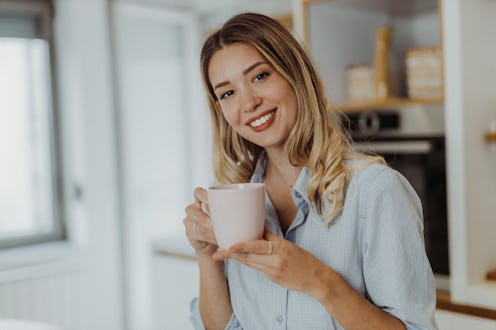 Young woman drinking coffee