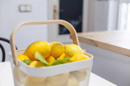 Basket full of lemons in the kitchen of a house, January 2022, Andalusia, Spain