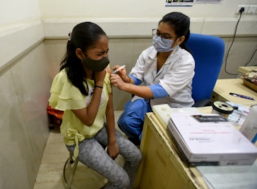 NOIDA, INDIA - MAY 13: You adults in the age group of 15 to 18 years being vaccinated with Covid-19 ...