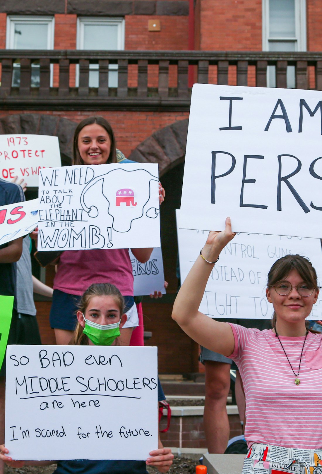 Protesters in Bloomsburg, PA hold signs during an abortion rights rally at the Columbia County court...