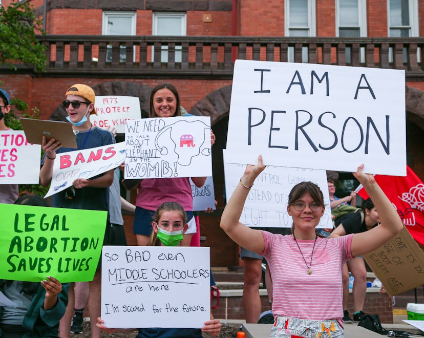 Protesters in Bloomsburg, PA hold signs during an abortion rights rally at the Columbia County court...