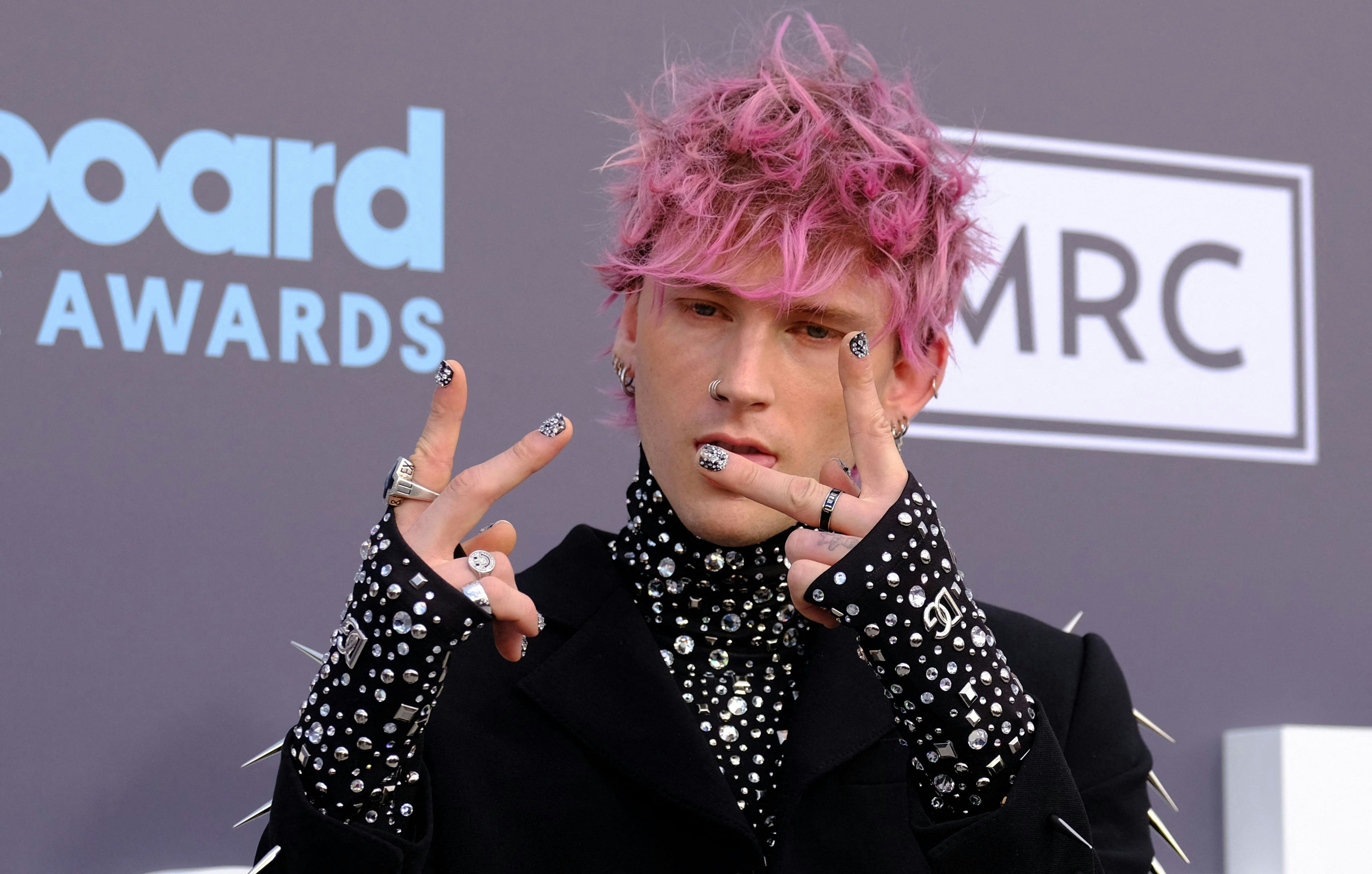 US rapper Machine Gun Kelly attends the 2022 Billboard Music Awards at the MGM Grand Garden Arena in...