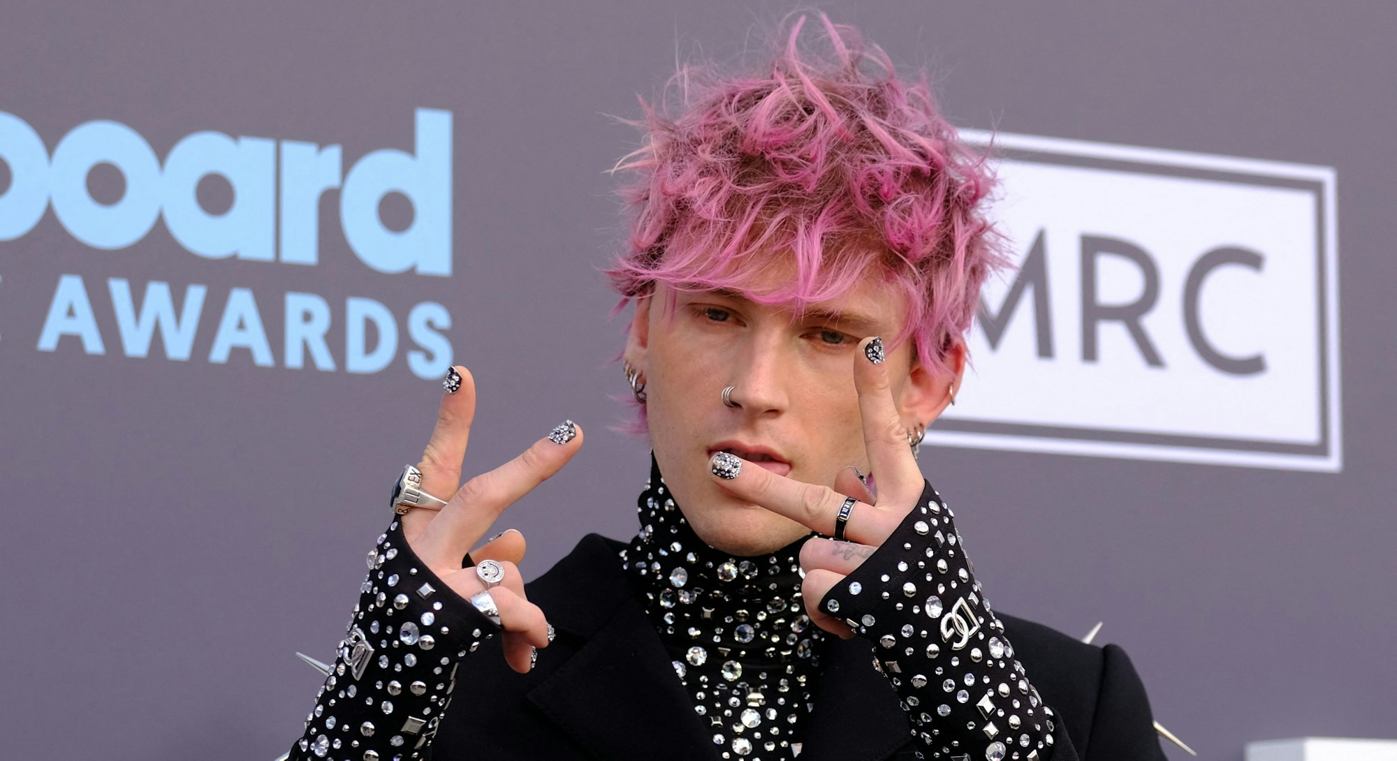 US rapper Machine Gun Kelly attends the 2022 Billboard Music Awards at the MGM Grand Garden Arena in...