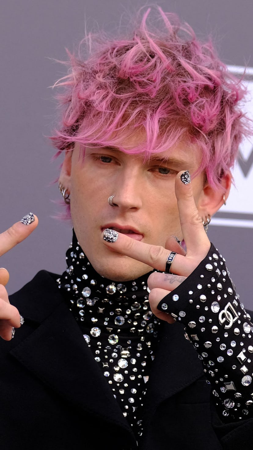 US rapper Machine Gun Kelly attends the 2022 Billboard Music Awards at the MGM Grand Garden Arena in...
