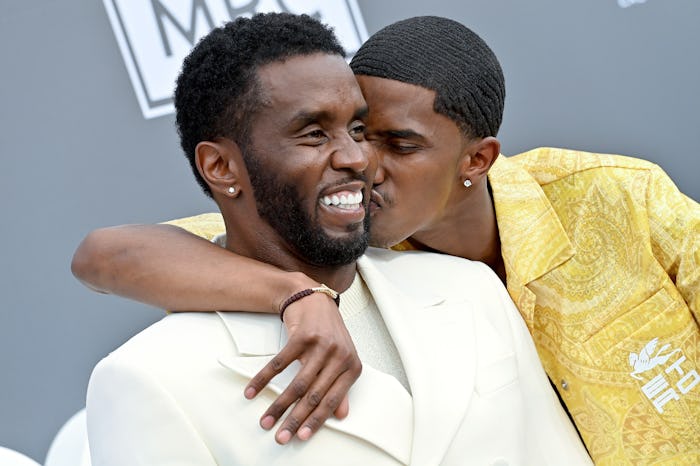 Christian Combs kisses his father, Sean 'Diddy' Combs'  at  the 2022 Billboard Music Awards.