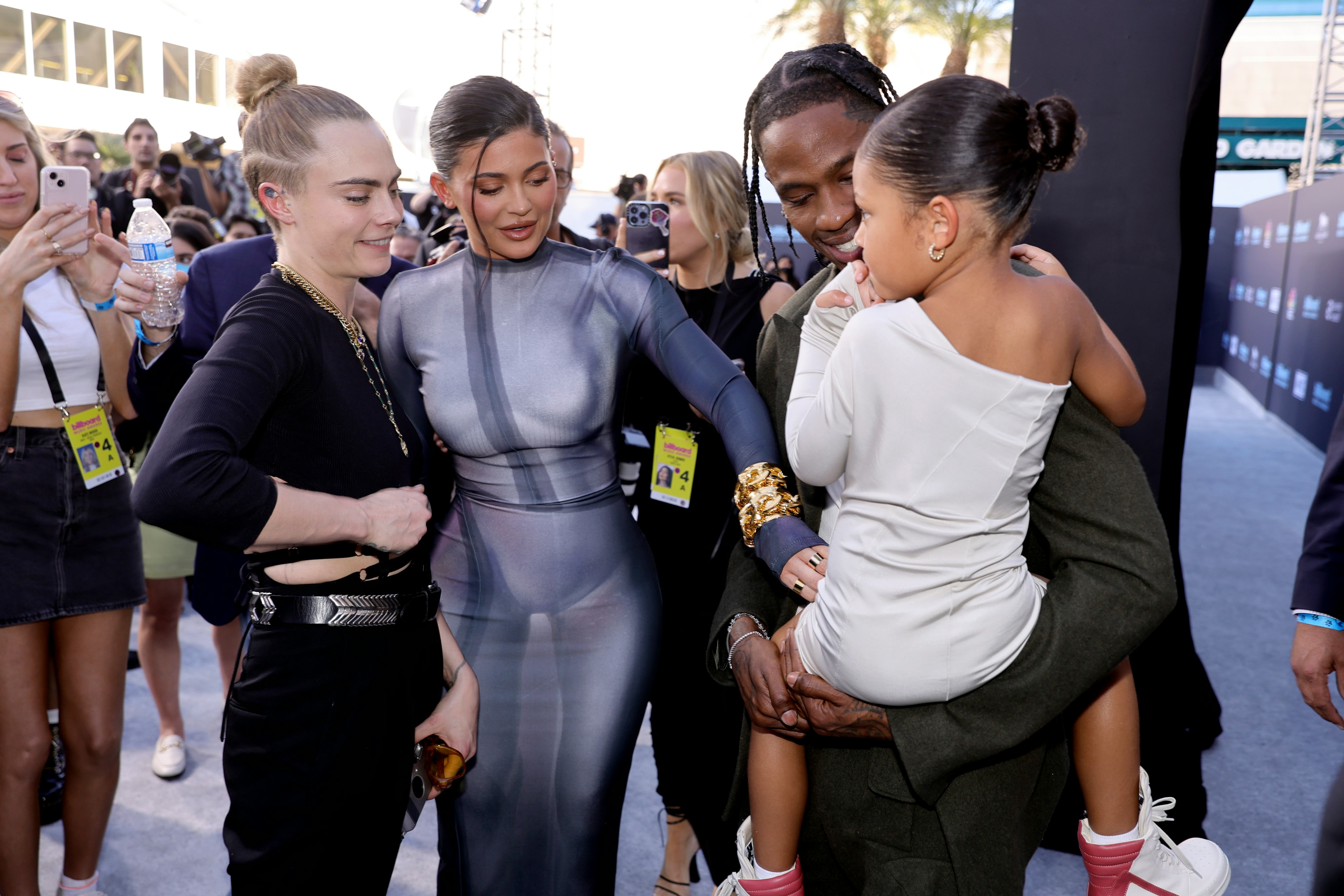 LAS VEGAS, NEVADA - MAY 15: (L-R) Cara Delevingne, Kylie Jenner, Travis Scott, and Stormi Webster at&hellip;