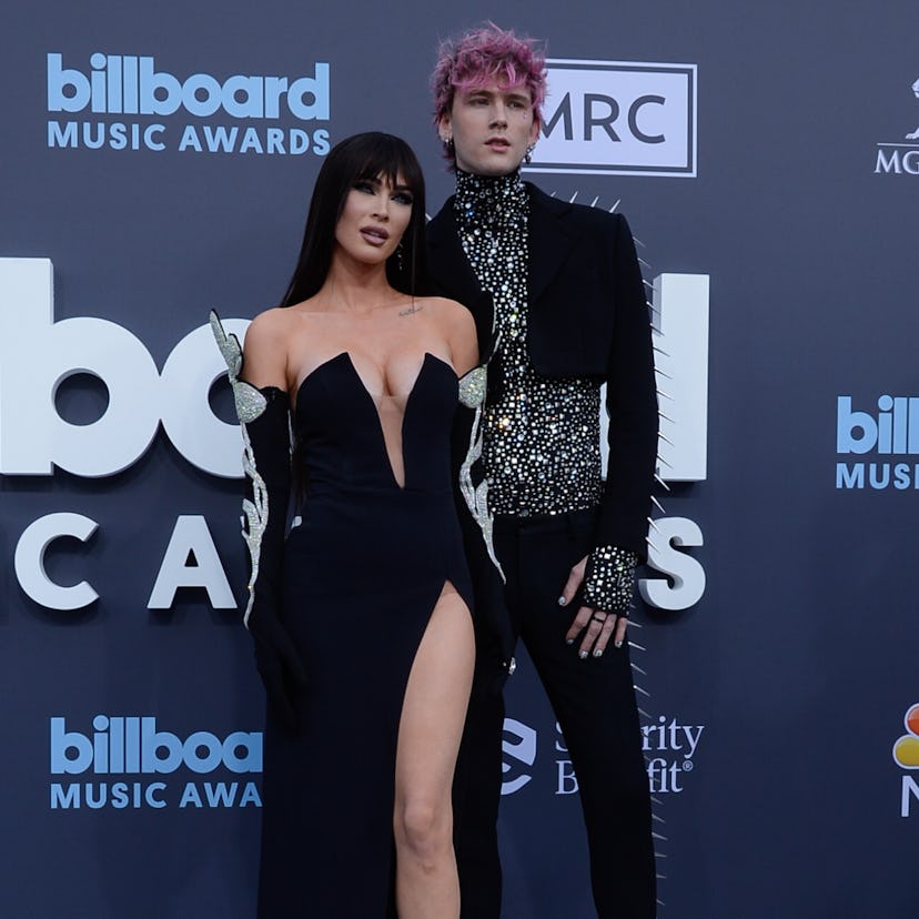 Megan Fox and Machine Gun Kelly attend the 2022 Billboard Music Awards with bangs and a $30,000 diam...