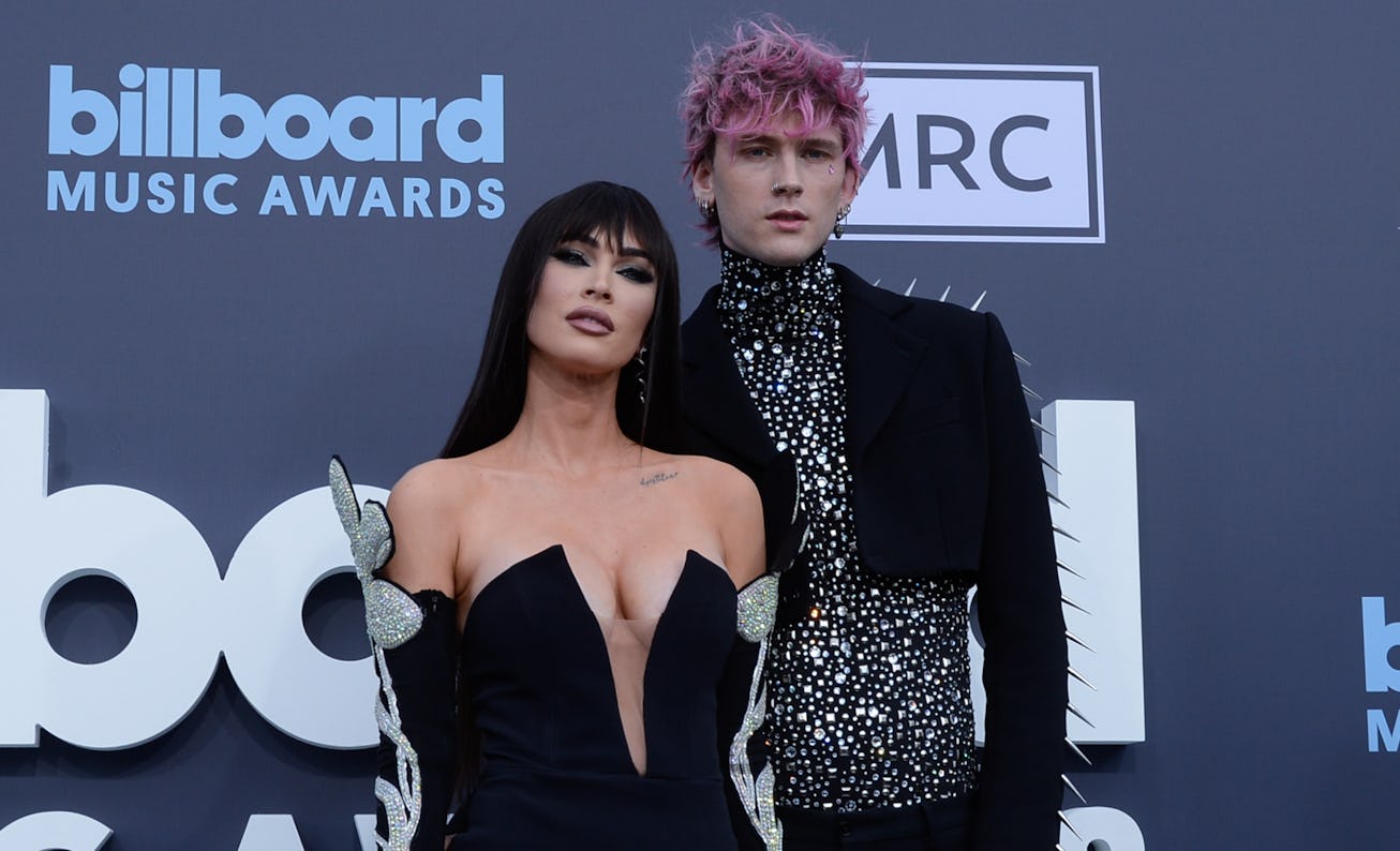 LAS VEGAS, NEVADA - MAY 15: Megan Fox (L) and Machine Gun Kelly attend the 2022 Billboard Music Awa...