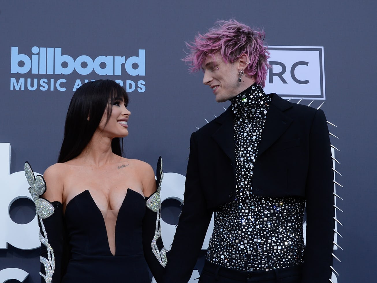 LAS VEGAS, NEVADA - MAY 15: Megan Fox (L) and Machine Gun Kelly attend the 2022 Billboard Music Awa...