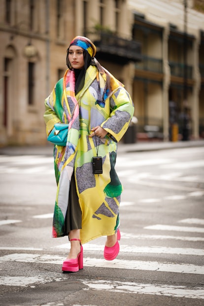 SYDNEY, AUSTRALIA - MAY 09: Nawal Sari is wearing Romance Was Born outfit/ scarf,  Valentino bag and...