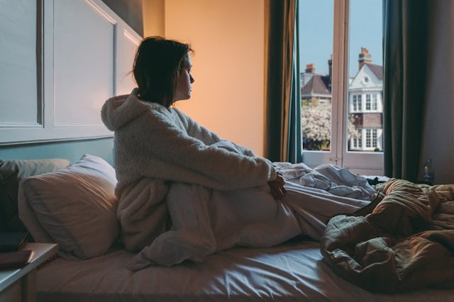 Woman with COVID-19 staying home