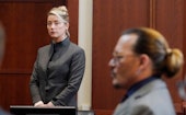 Actors Amber Heard and Johnny Depp watch as the jury leave the courtroom for a lunch break at the Fa...