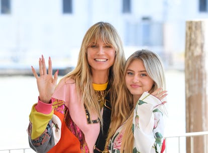 Heidi Klum and Leni Klum waving ahead of Leni wearing Heidi's vintage dress for prom.