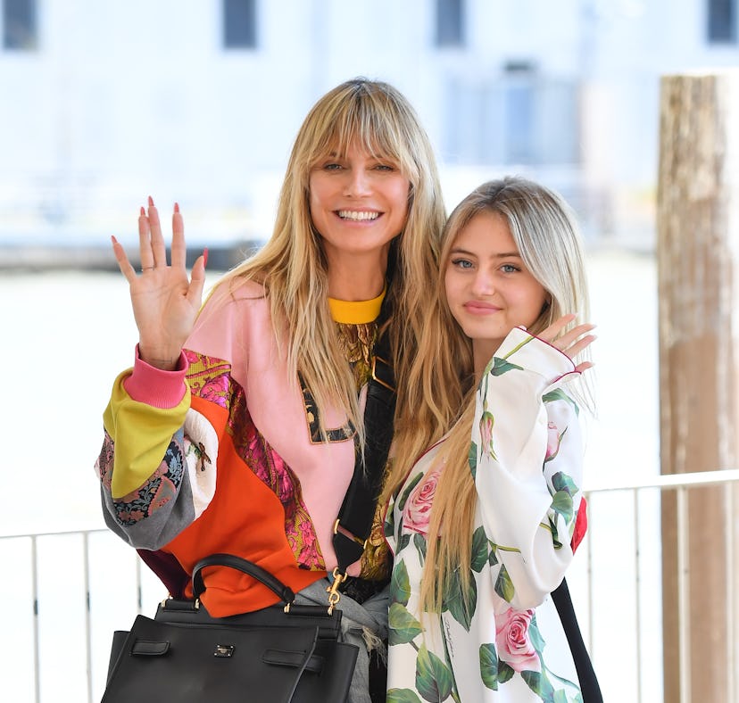 Heidi Klum and Leni Klum waving ahead of Leni wearing Heidi's vintage dress for prom.