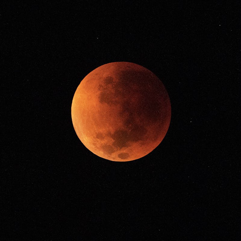 TOPSHOT - The blood moon is seen during a total lunar eclipse in Rio de Janeiro on May 16, 2022. (Ph...