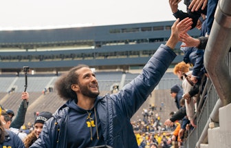 ANN ARBOR, MI - APRIL 02: Colin Kaepernick interacts with fans as he leaves the field following the ...