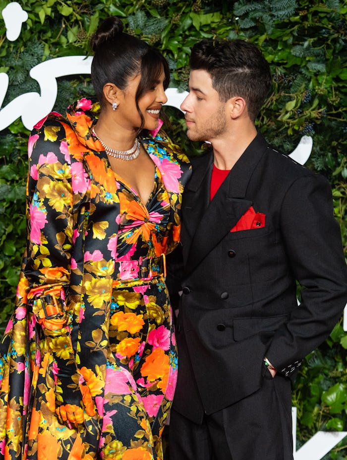 LONDON, ENGLAND - NOVEMBER 29: Priyanka Chopra and Nick Jonas attend Fashion Awards 2021 at the Roya...