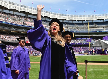 Singer Taylor Swift waves at graduating students during New York University's commencement ceremony ...