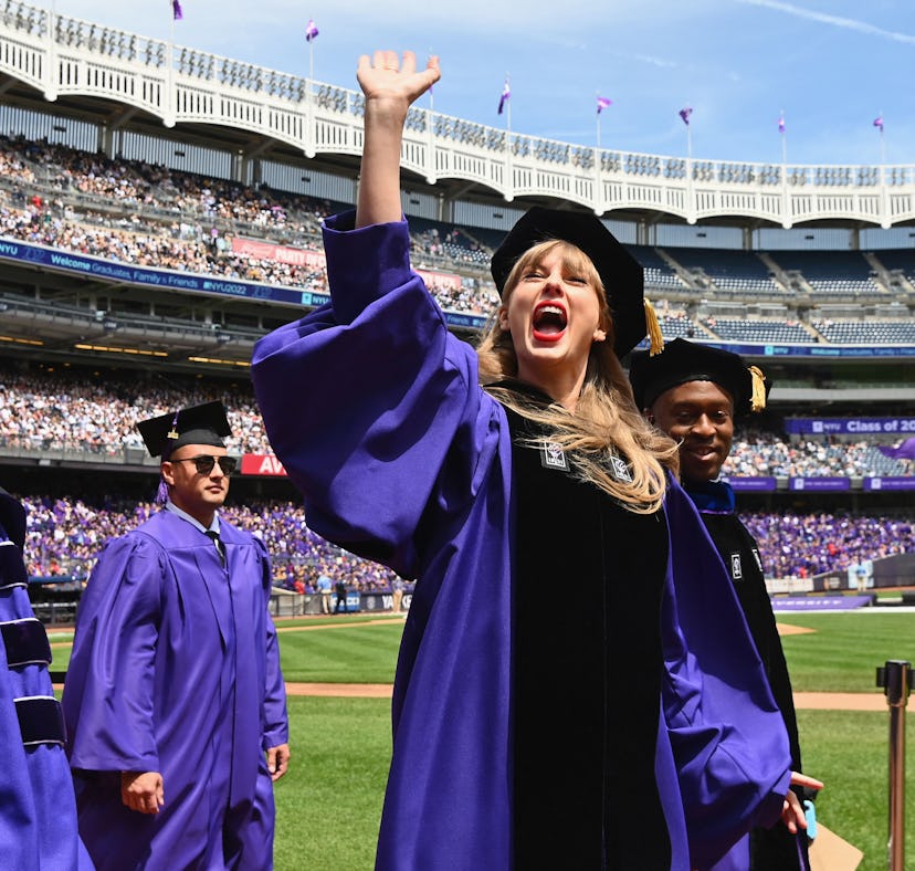 Singer Taylor Swift waves at graduating students during New York University's commencement ceremony ...