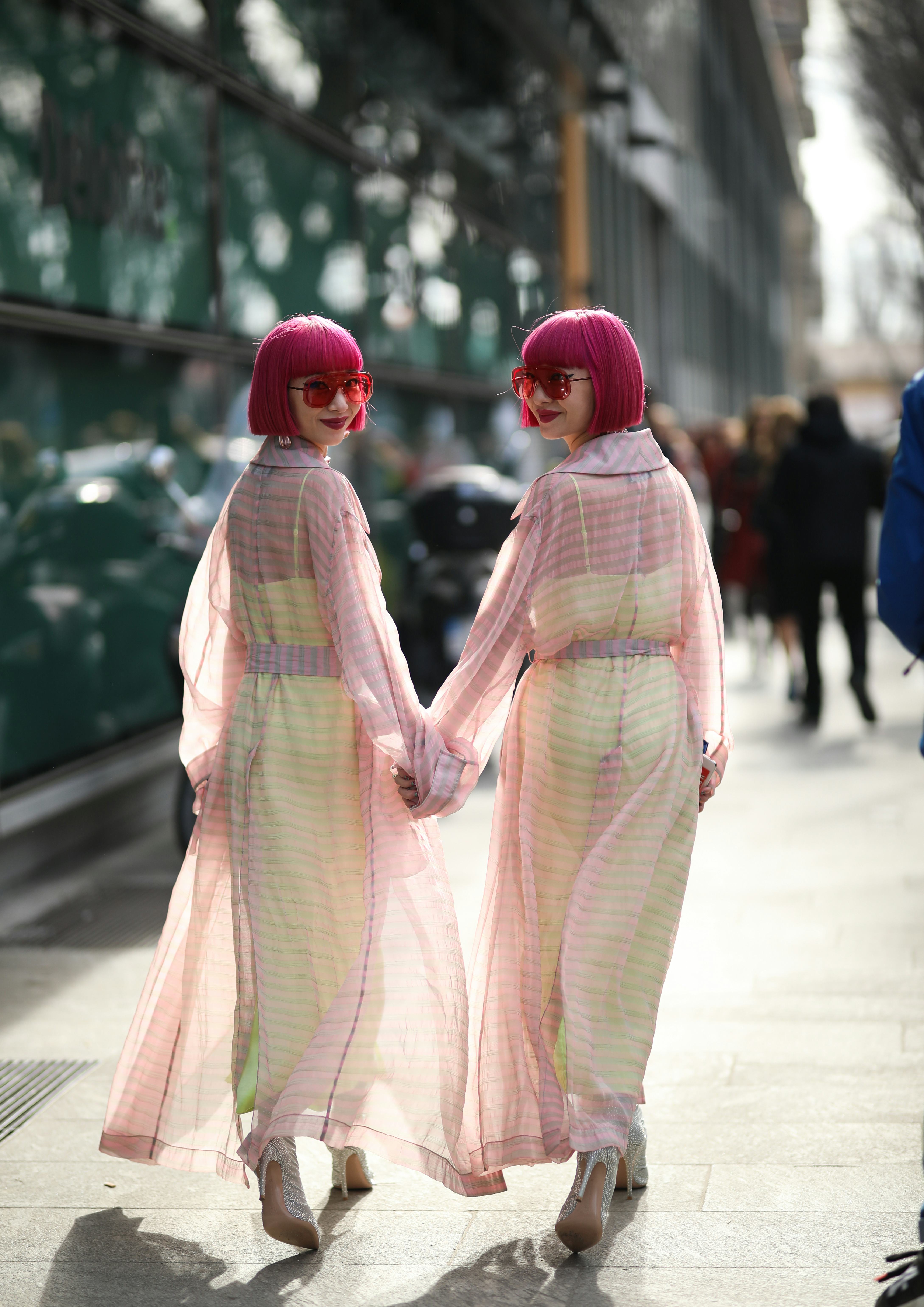 MILAN, ITALY - FEBRUARY 21: Ami Amiaya and Aya Amiaya is seen before Emporio Armani during Milan Fas...