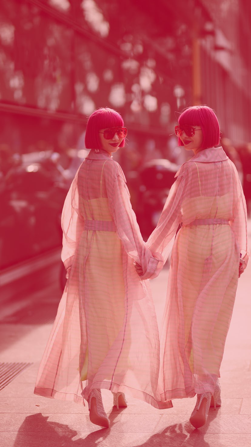 MILAN, ITALY - FEBRUARY 21: Ami Amiaya and Aya Amiaya is seen before Emporio Armani during Milan Fas...
