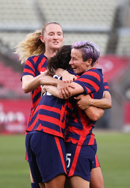 KASHIMA, JAPAN - AUGUST 05: Carli Lloyd #10 of Team United States celebrates with teammate Megan Rap...
