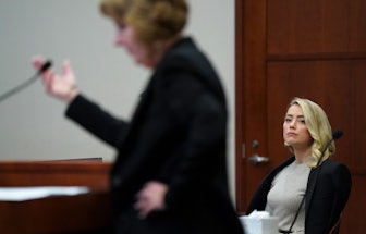 Actor Amber Heard listens as her lawyer Elaine Bredehoft questions her sister Whitney Henriquez (not...