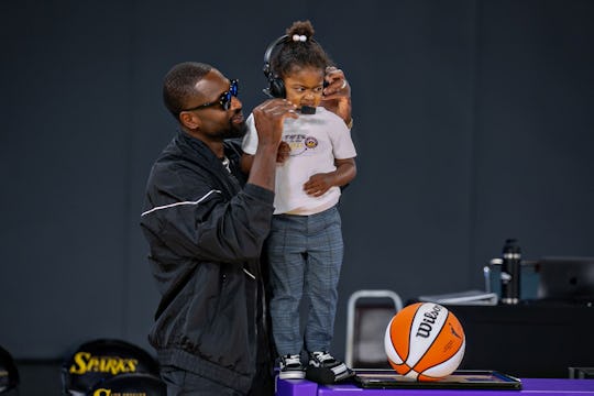 LOS ANGELES, CA - JUNE 30: Kaavia Wade wants no part of a half time interview with her dad Dwayne Wa...