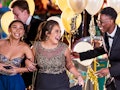 A group of friends use instagram captions for prom for pictures at their school dance.