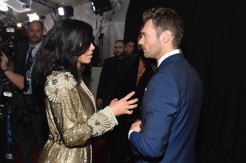 Kim Kardashian and Ryan Seacrest attend The 57th Annual GRAMMY Awards at the STAPLES Center on Febru...