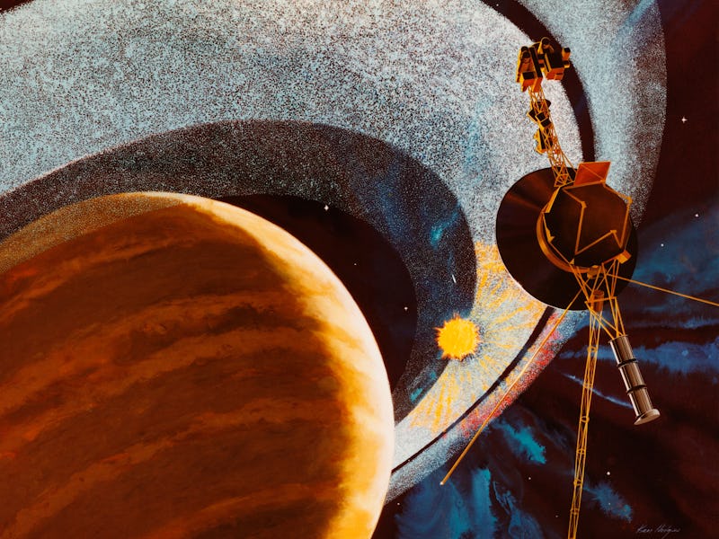An artist's impression of NASA's Voyager 1 space probe passing behind the rings of Saturn, using cam...