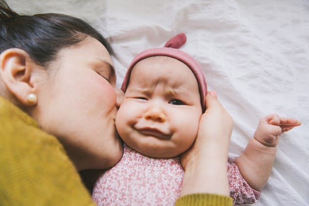 mom kissing baby girl, baby girl names that start with e