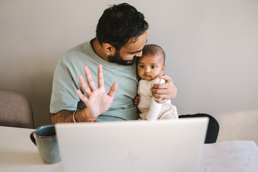 baby and dad looking at computer, instagram captions for when baby says dada for the first time