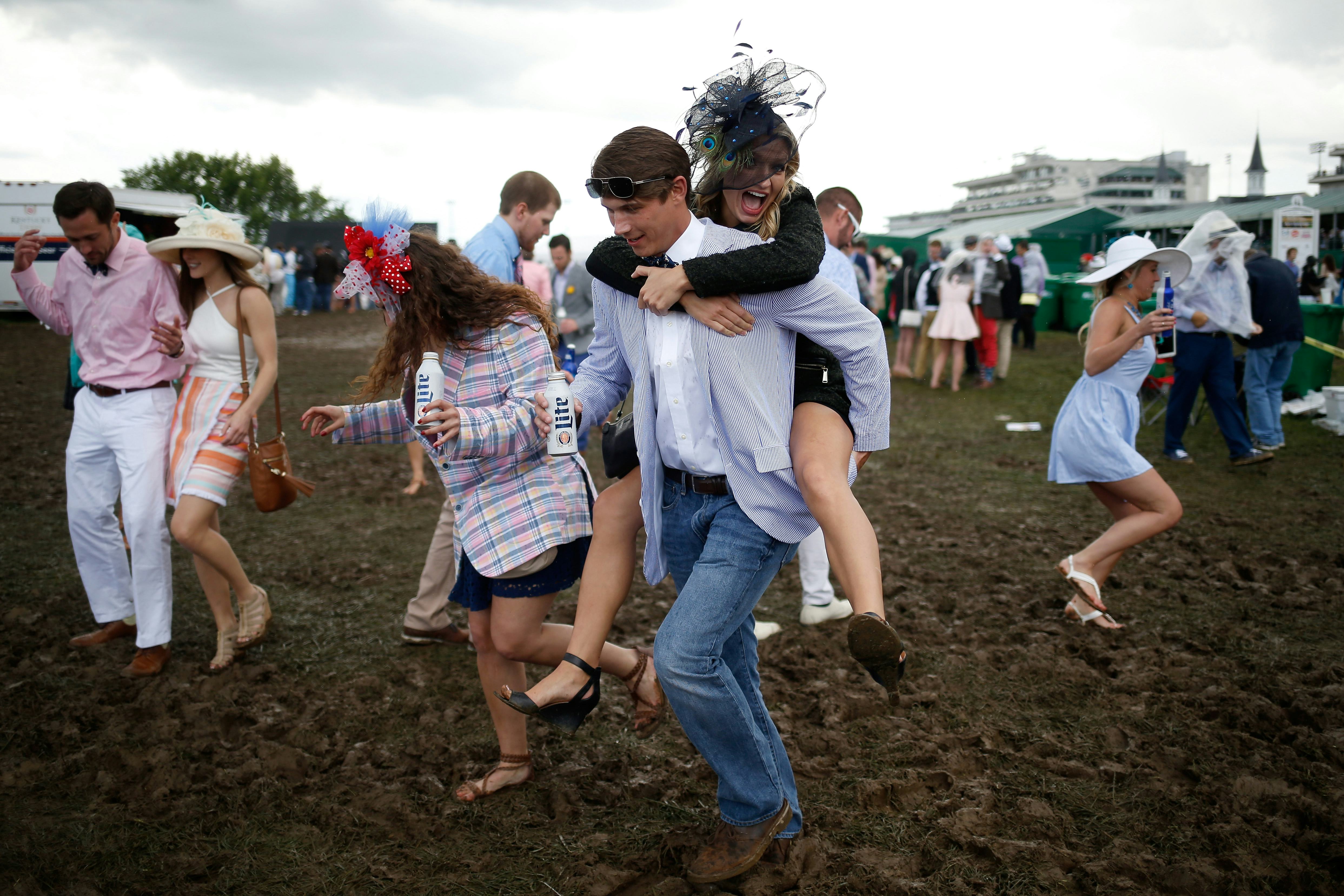 LOUISVILLE, KY - MAY 06:  Fans make their way through the infield prior to the 143rd running of the ...