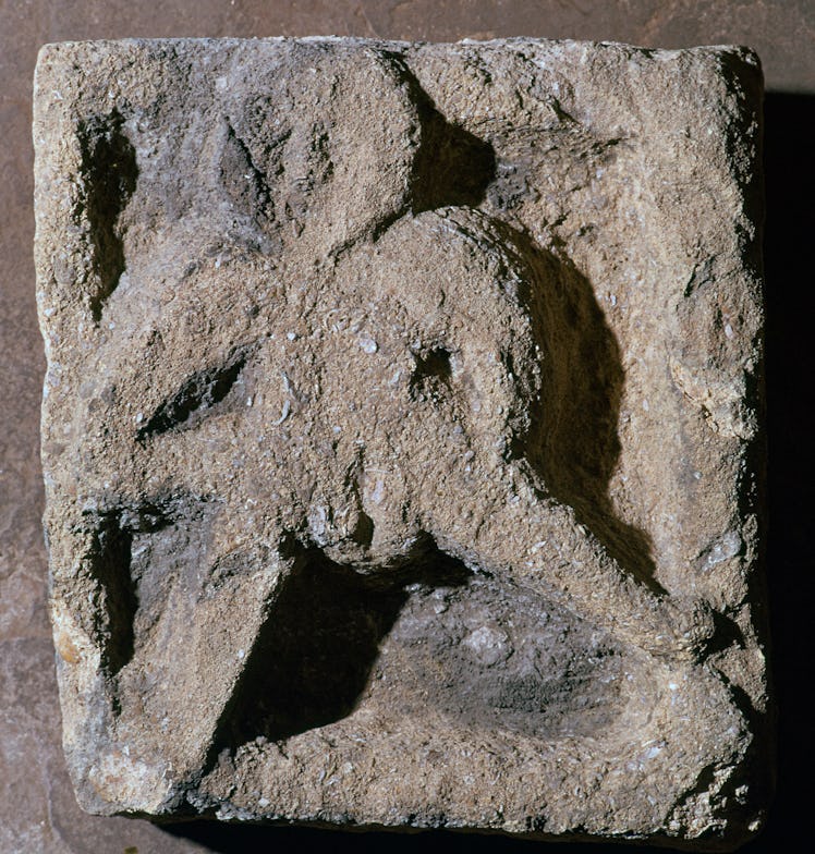 Sheelah-Na-Gig in local shelly limestone, at the church of St Michael in the Northgate, Oxford. The ...