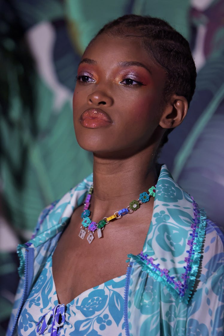 A model wearing lip gloss walks the runway at the Anna Sui Spring Summer 2022 fashion show during NY...