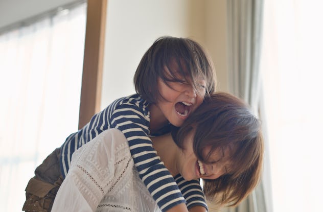 mother and daughter laughing over mother's day jokes