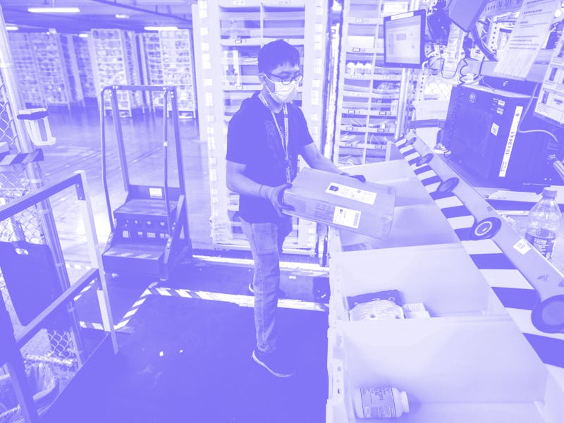 EASTVALE, CA - AUGUST 31: Worker Taiki Okamoto, 20, fulfills an order from a row of bins that are ro...