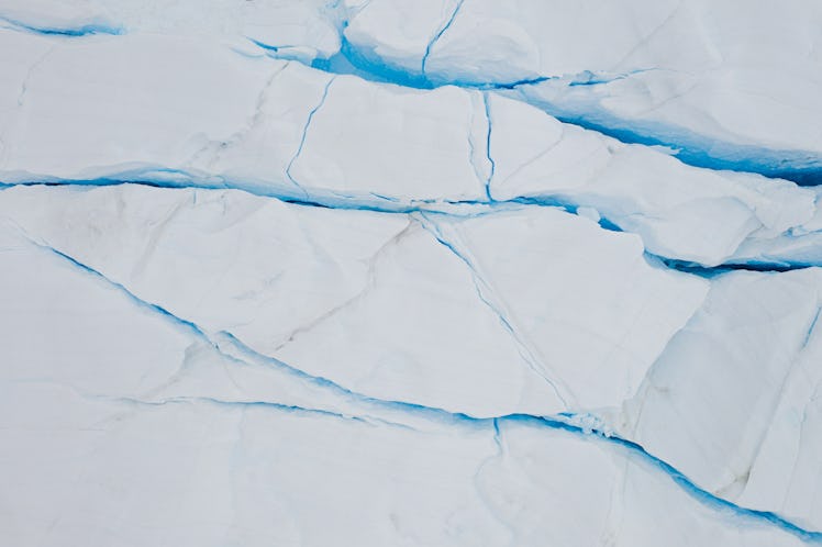 top down view of cracks into a iceberg due to climate change in Ilulissat Icefjord, Disko bay, West ...