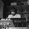 Greek composer of electronic music, Vangelis, sitting at an Italian, Elka synthesizer, 28th January ...