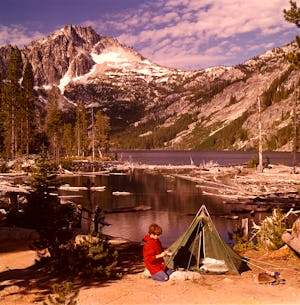 1970s Teen Boy Kneeling Campsite Green Tent Washing Tin Cup Snow Lakes Mcclellan Peak Washington Sta...