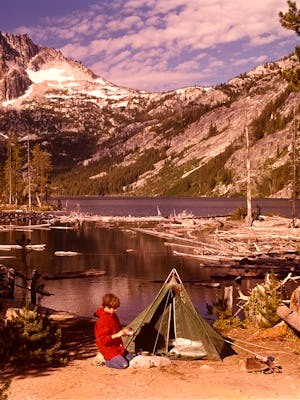 1970s Teen Boy Kneeling Campsite Green Tent Washing Tin Cup Snow Lakes Mcclellan Peak Washington Sta...