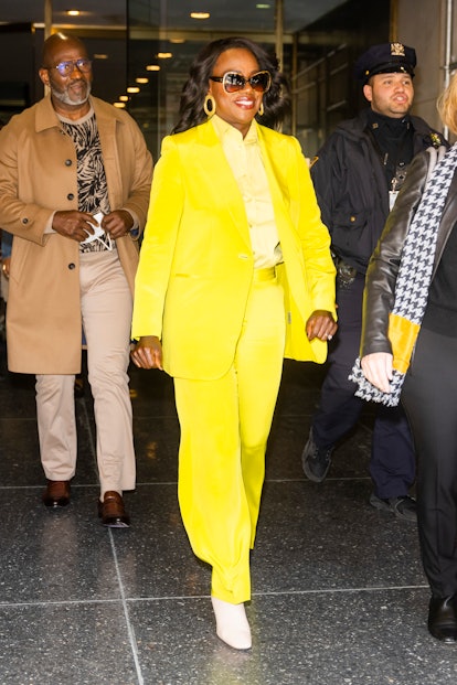Viola Davis wears a yellow Lafayette 148 New York suit.