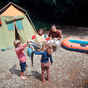 1960s 1970s FAMILY OF FOUR CAMPING AND FISHING BY STREAM  (Photo by H. Armstrong Roberts/ClassicStoc...