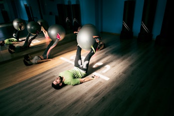 Balloon classroom in gym. People training. Gym training of a small group of people to strengthen the...