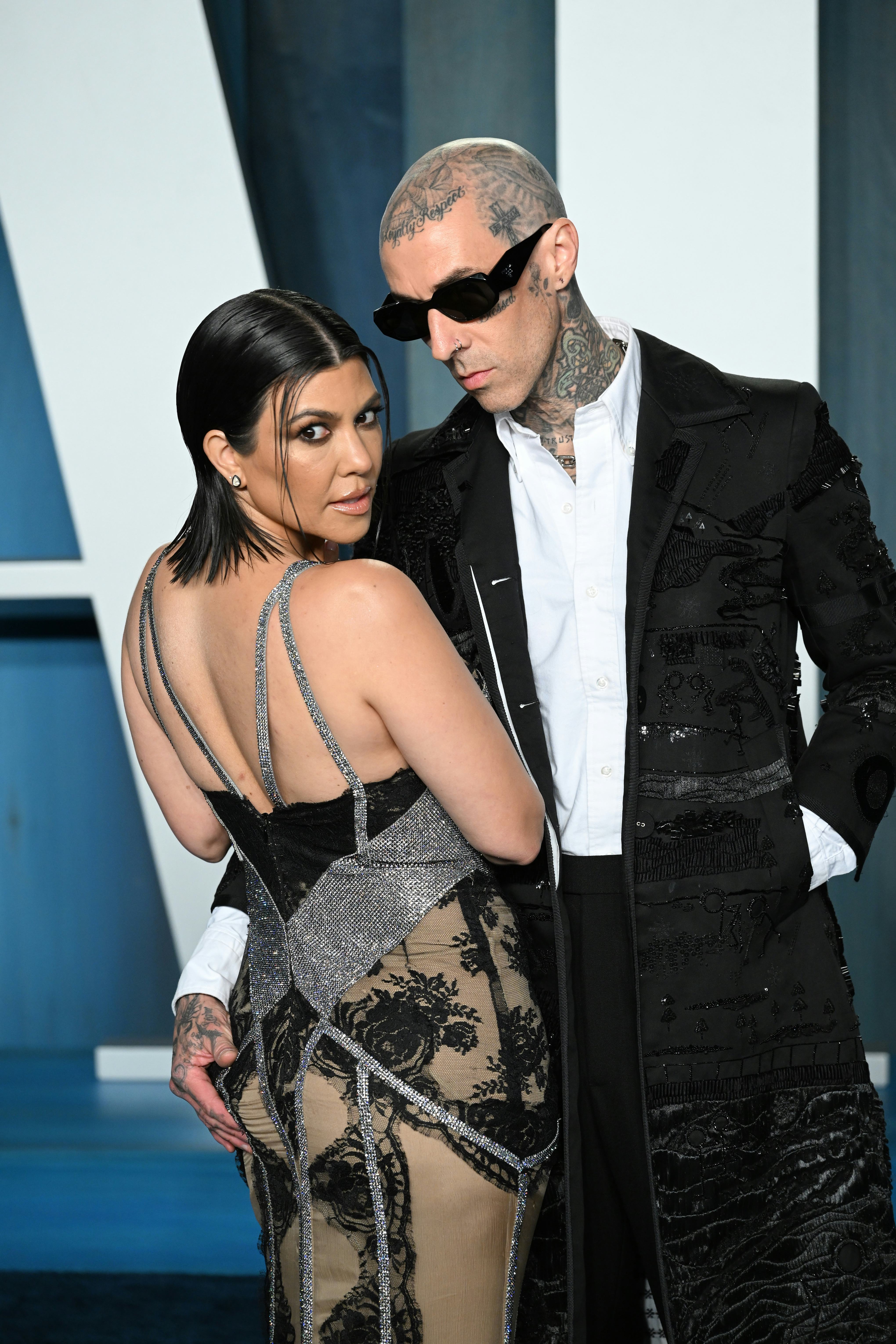 BEVERLY HILLS, CALIFORNIA - MARCH 27: Kourtney Kardashian and Travis Barker attend 2022 Vanity Fair ...